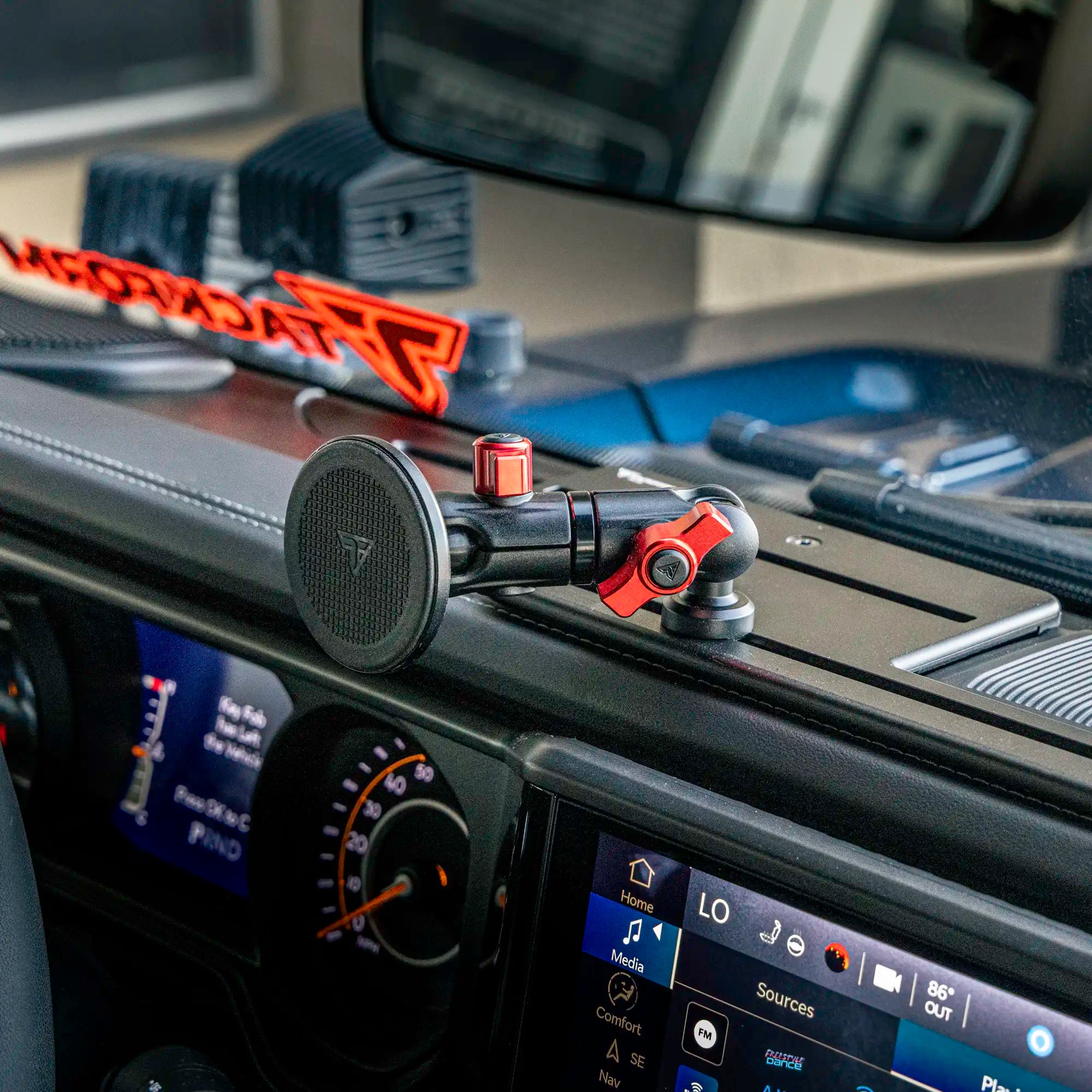 magsafe phone mount with red accent hardware on an all-metal full-width dash bracket installed in a jeep gladiator
