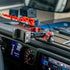 all-metal phone mount with red accents on a full-width dash bracket installed in a jeep gladiator