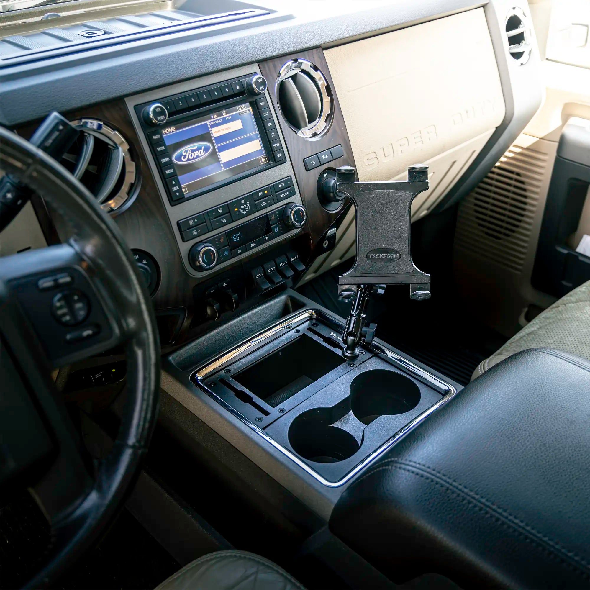 Black tablet mount installed in the center console of a ford super duty
