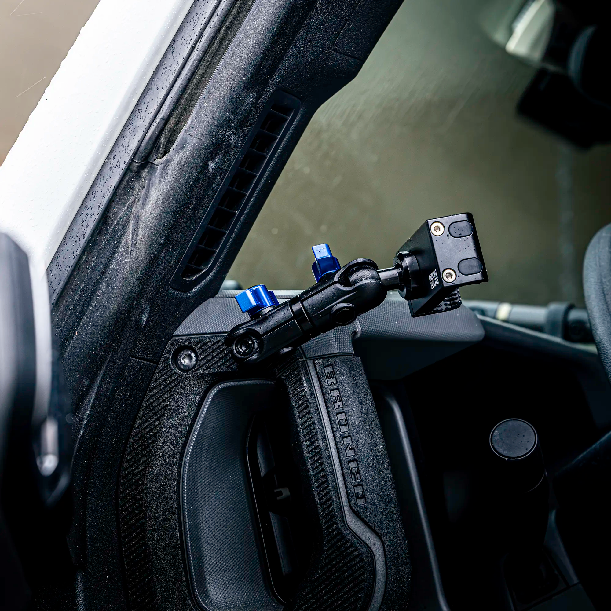Ford Bronco phone mount with billet spring cradle installed on driver side grab handle