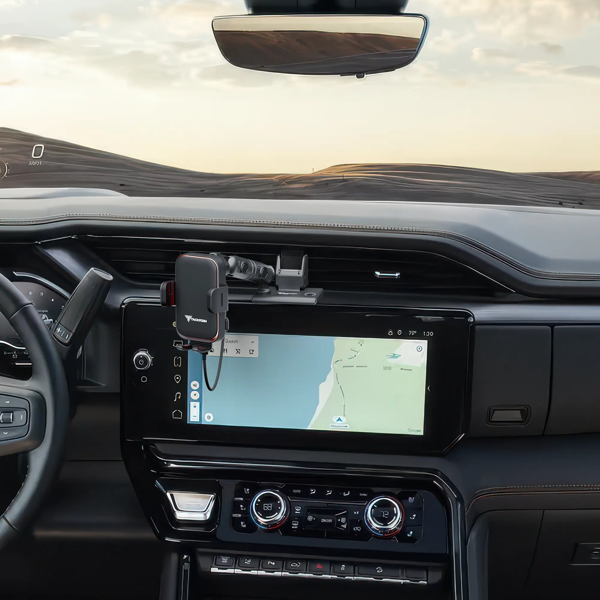 Wireless charging phone cradle attached to an all-metal dash clip installed in a GMC Sierra